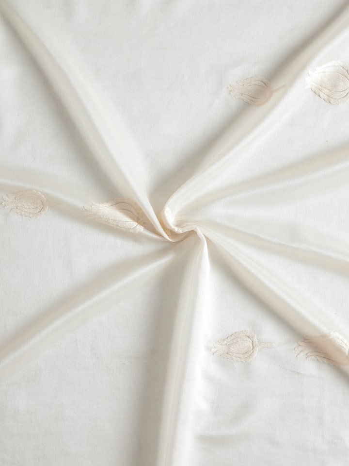 Full view of Razza ivory tulip buti cotton silk crewel hand embroidered sheer curtain displaying the overall design and sheer fabric.