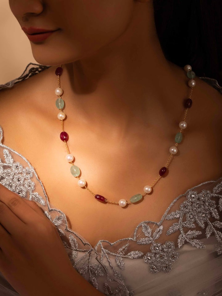 Styled detail view of Gemstone Strings Silver Long Necklace worn on the finger, shown in an alternate styled shot