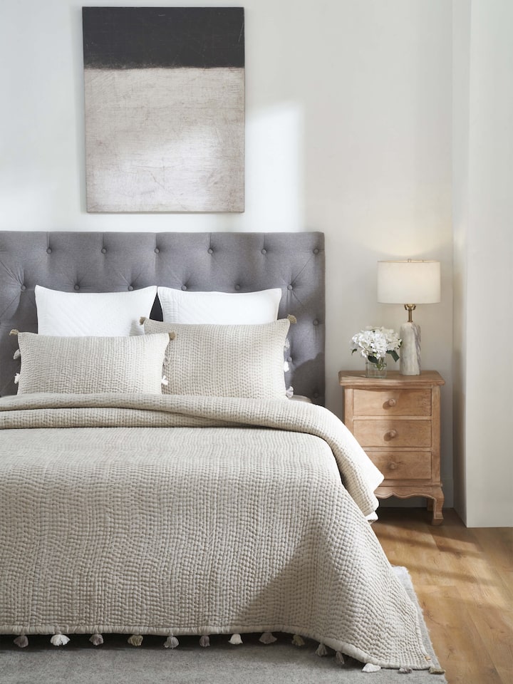 Close-up of Ahilya grey textured silk razai embroidered double bedspread set, focusing on the intricate embroidery and silk texture.