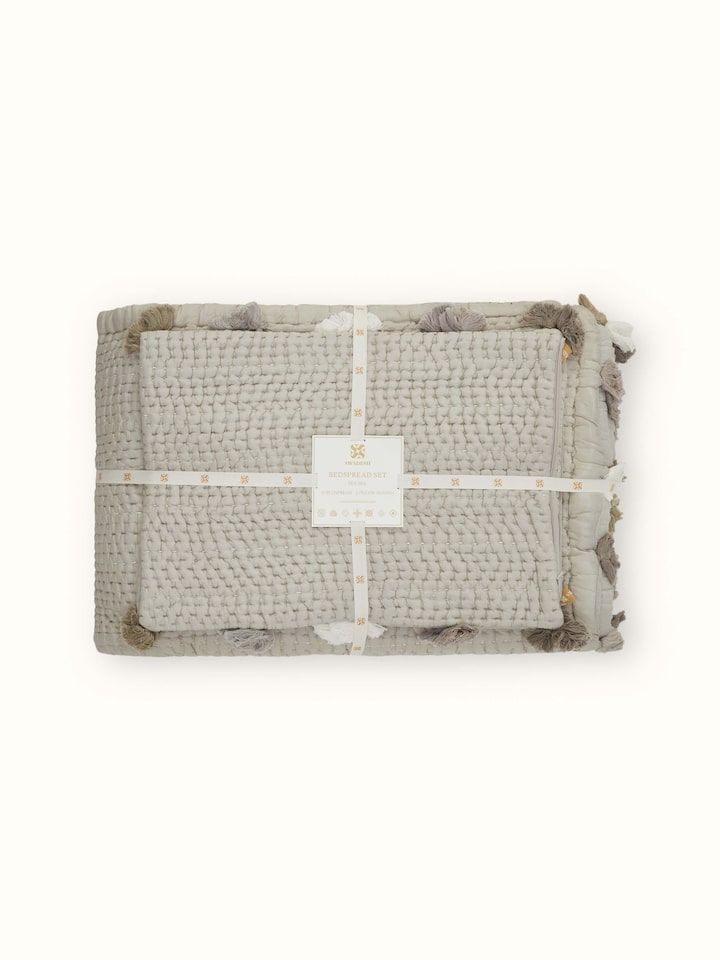 Close-up of Ahilya grey textured silk razai embroidered double bedspread set, emphasizing the details of the embroidery and silk texture.