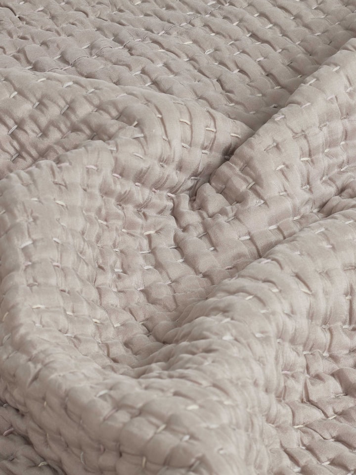 Side view of brown textured silk razai embroidered double bedspread set, focusing on the elegant embroidery and fabric quality.