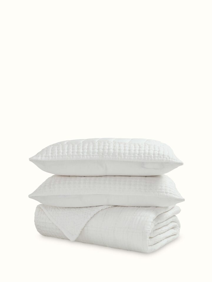 Front view of Pipa ivory solid silk razai embroidered double bedspread set (3 pcs) highlighting its elegant embroidery.