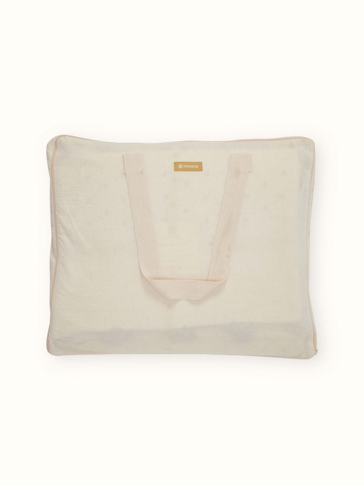Side view of Nitya off-white textured stripe cotton razai embroidered double bedspread set showcasing the bedspread's thickness and pattern