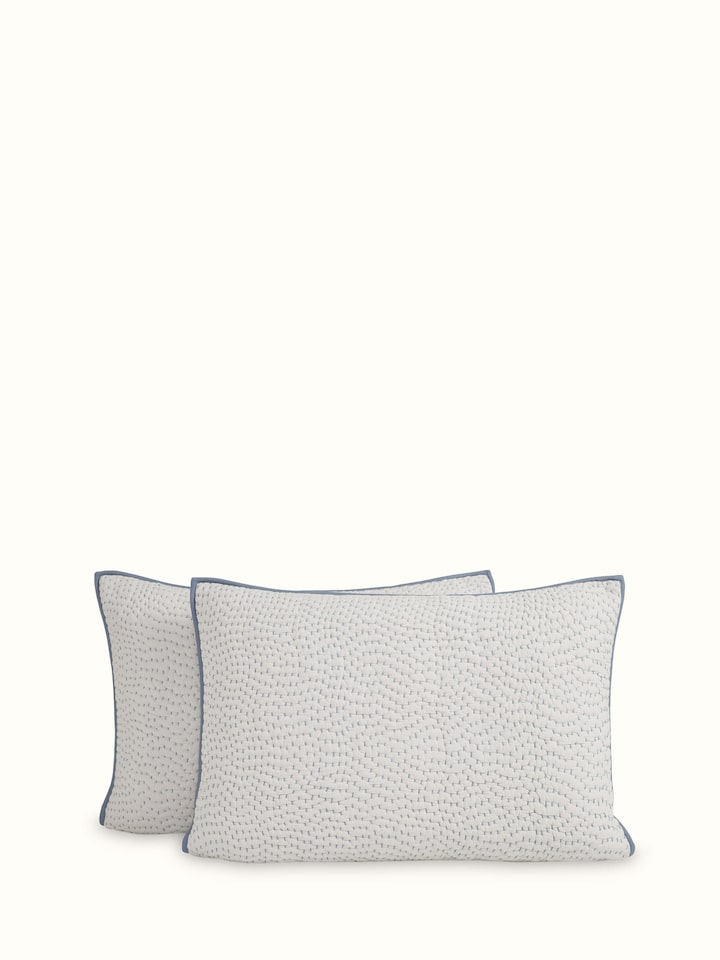 Angled view of a beige two-tone textured cotton razai embroidered double bedspread set, showcasing the elegant design and detailed embroidery.