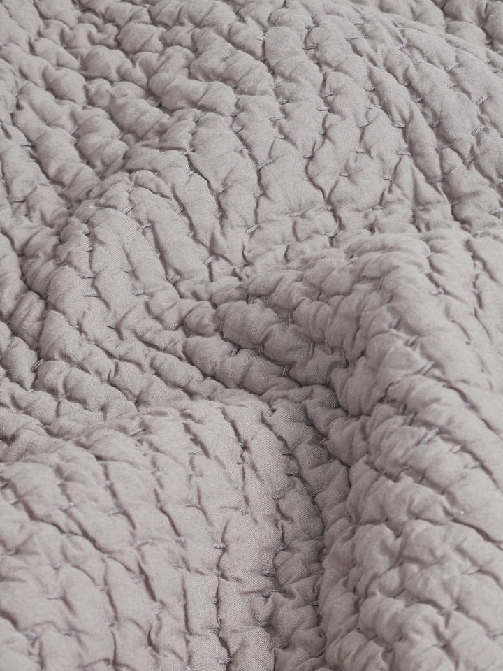 Close-up of Nityam grey textured cotton razai double bedspread set (3 pcs) showcasing intricate embroidery and textured fabric