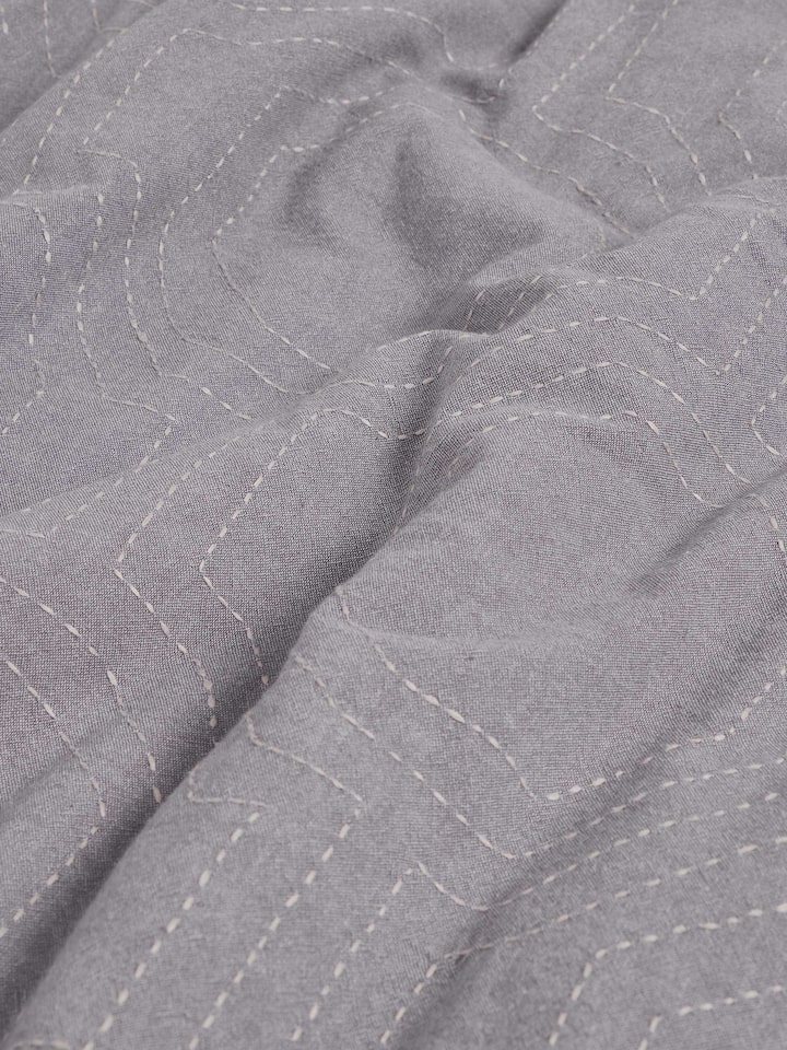 Side view of Kahani grey geometric cotton kantha embroidered queen duvet cover emphasizing texture and fabric
