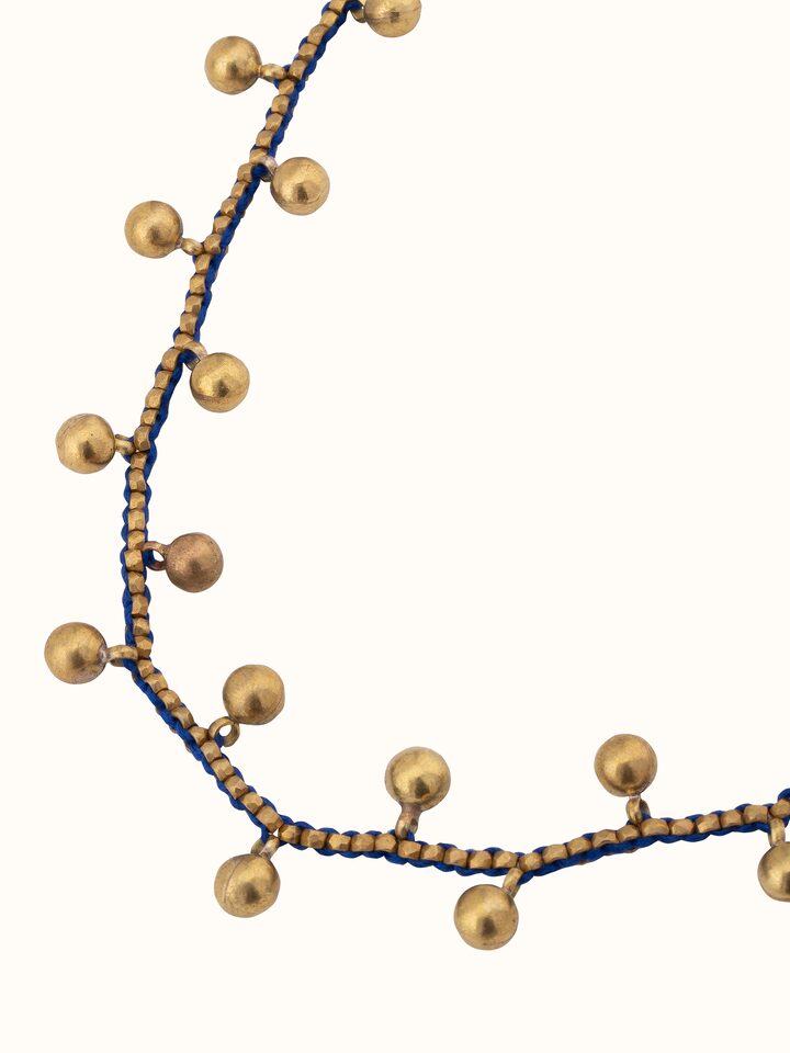 Detailed view of Dhokra Long Necklace focusing on the traditional metalwork and artistry.