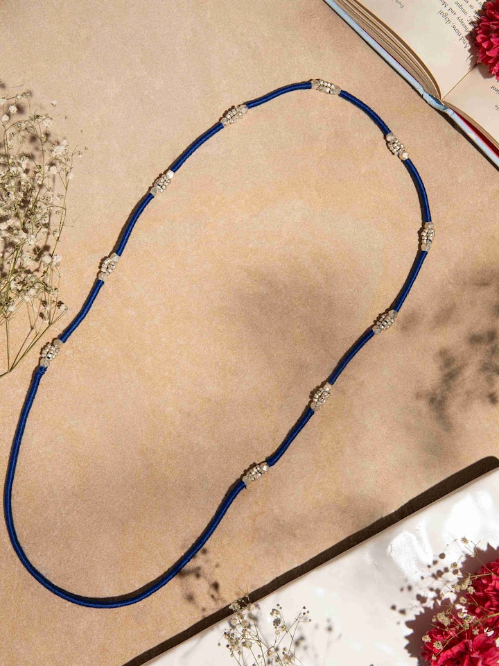 Close-up of Dhokra Long Necklace highlighting the intricate patterns and craftsmanship.