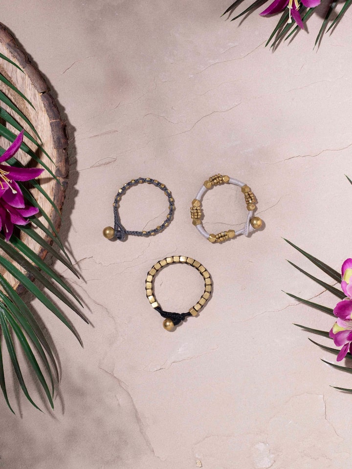 Side view of Dhokra bracelet set (3 pcs) displaying intricate designs and detailed craftsmanship