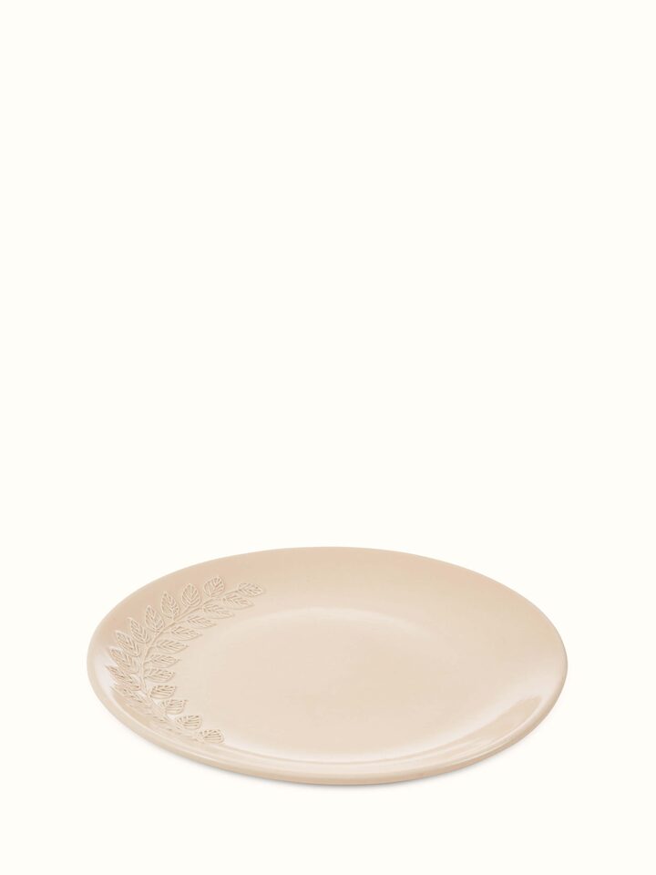 Angled view of Khurja Pottery Ceramic Dinner Plates in Pink, emphasizing the smooth curve and vibrant color