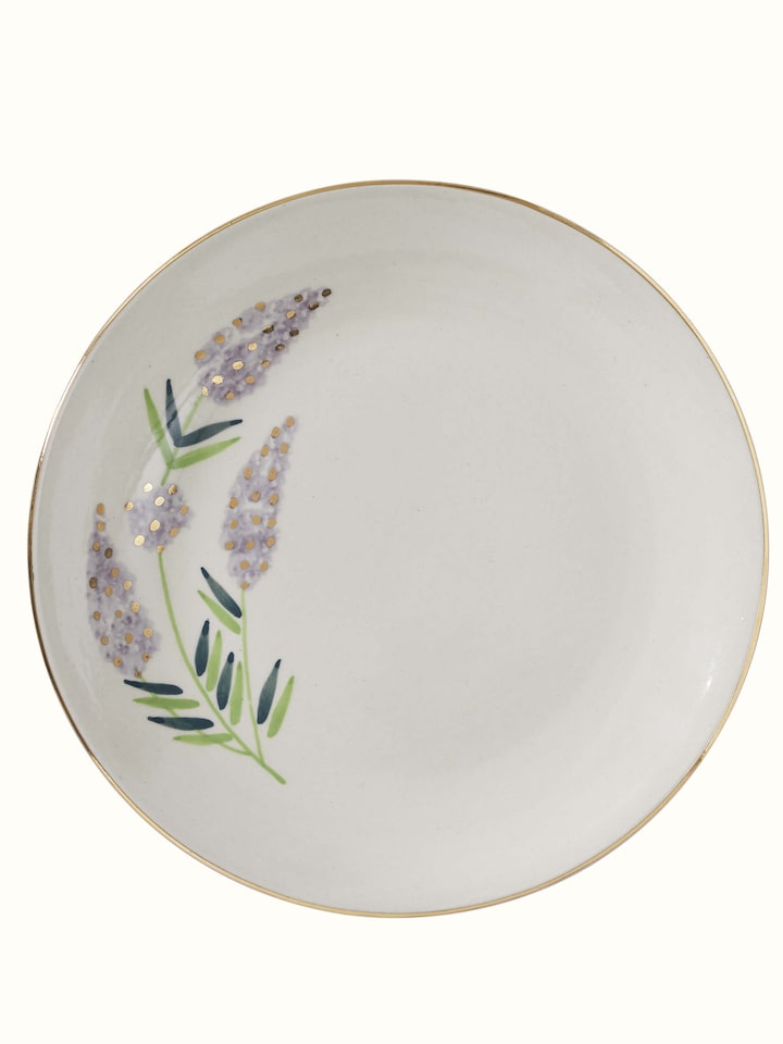 Close-up view of Khurja pottery stoneware dinner plates (4 pcs) highlighting detailed decoration and quality.