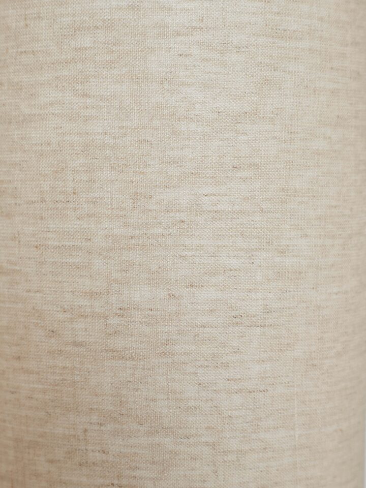 Close-up of Wooden Console Lamp with Beige Cotton Fabric Shade, highlighting the elegant base and shade design