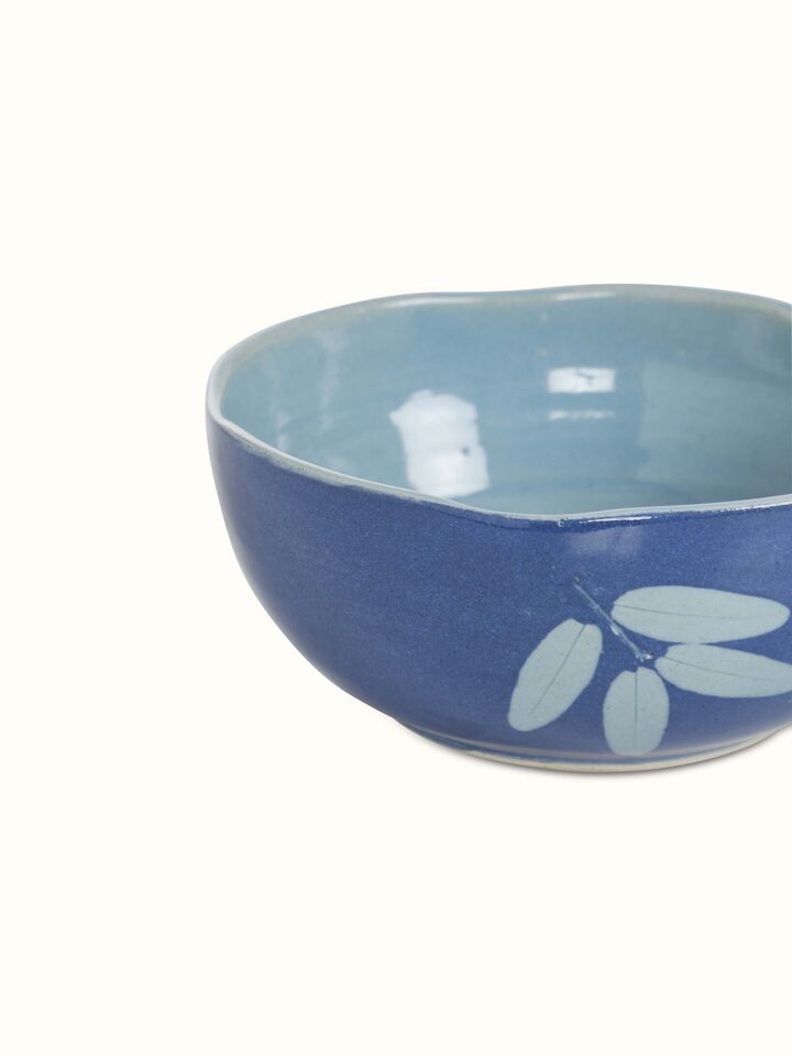 Artistic view of Studio pottery ceramic serving bowls in blue (3 pcs) with vibrant color accents