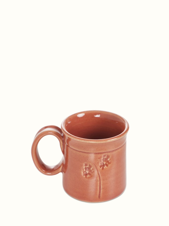 Close-up view of Studio pottery ceramic coffee mugs in various colors, set of 2, highlighting the texture