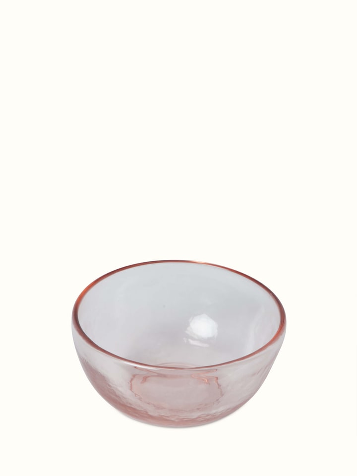 Close-up of Firozabadi glass serving bowl in pink, emphasizing its smooth surface and delicate design.