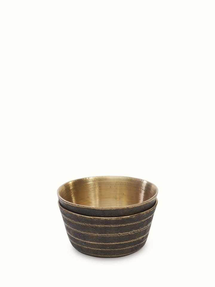 Front view of black bell metal dinner bowls set of 4 showcasing sleek design and shiny finish