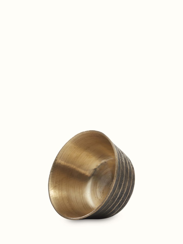 Angled view of black bell metal dinner bowls set of 4 highlighting smooth surface and elegant design