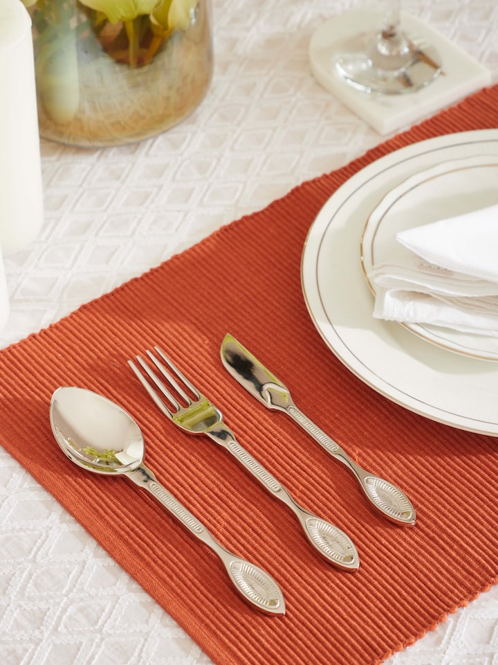 Side view of Brass cutlery set (3 pcs) showcasing the sleek lines and shiny surface of the cutlery.