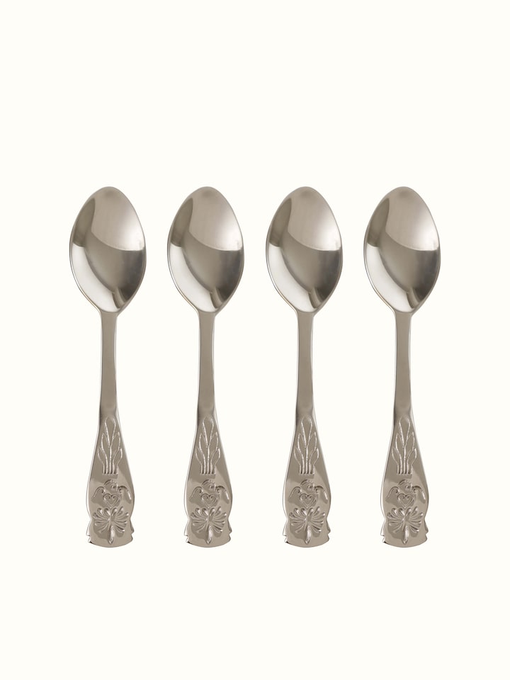 Detailed view of brass teaspoons, highlighting their polished finish and elegant design.