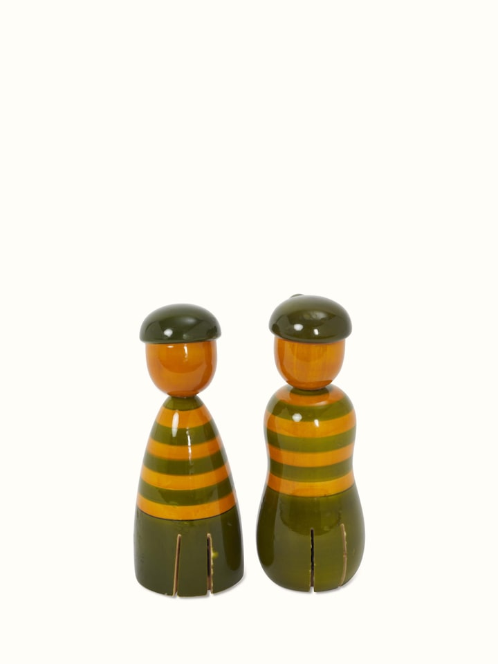 Angled view of Channapatna ivory wood boy & girl rattle toys in green displaying colorful patterns and traditional craftsmanship.