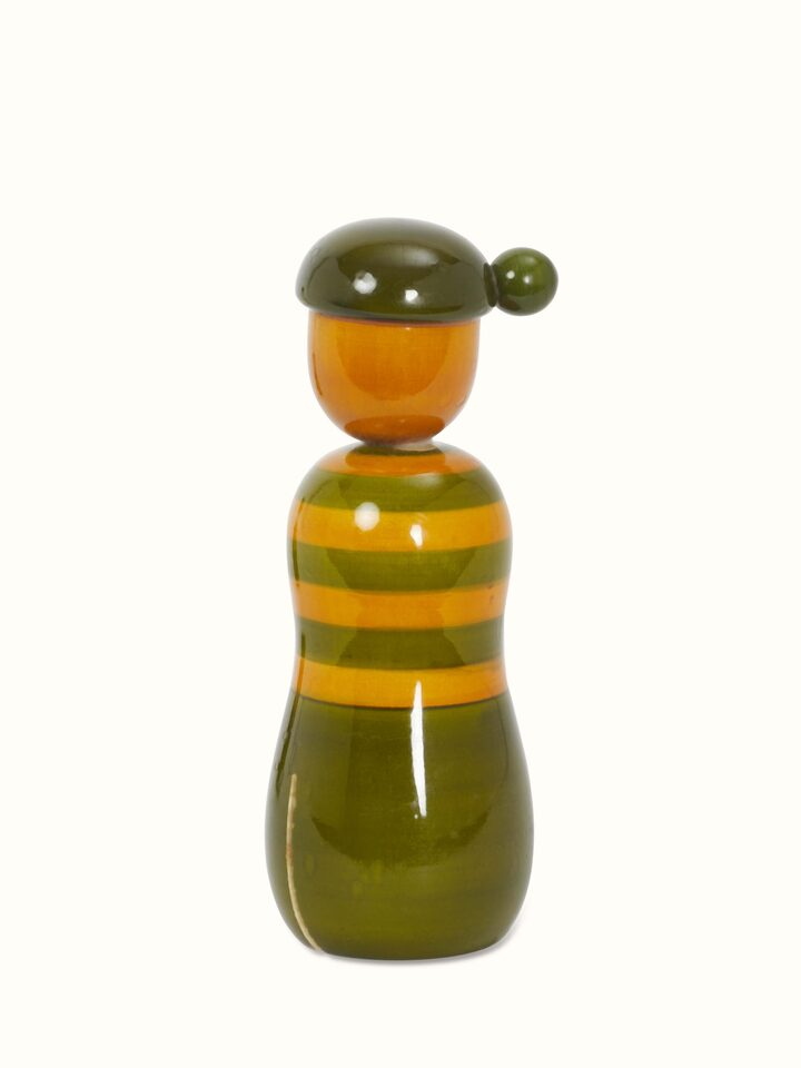 Side view of Channapatna ivory wood boy & girl rattle toys in green featuring hand-painted details and cultural significance.