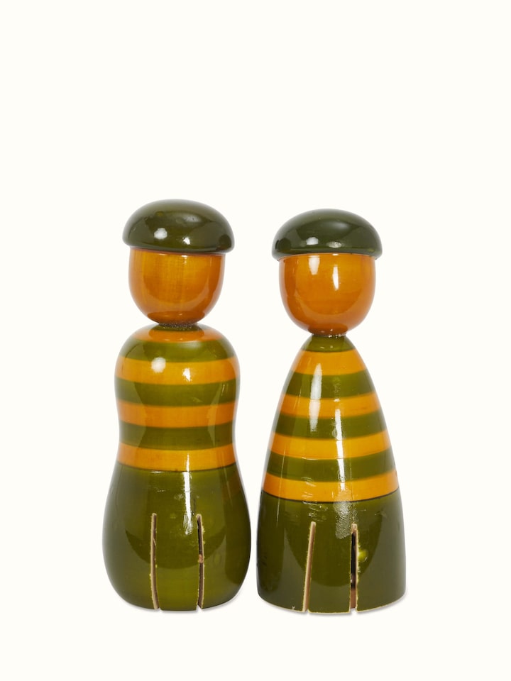 Back view of Channapatna ivory wood boy & girl rattle toys in green emphasizing the quality woodwork and traditional design.