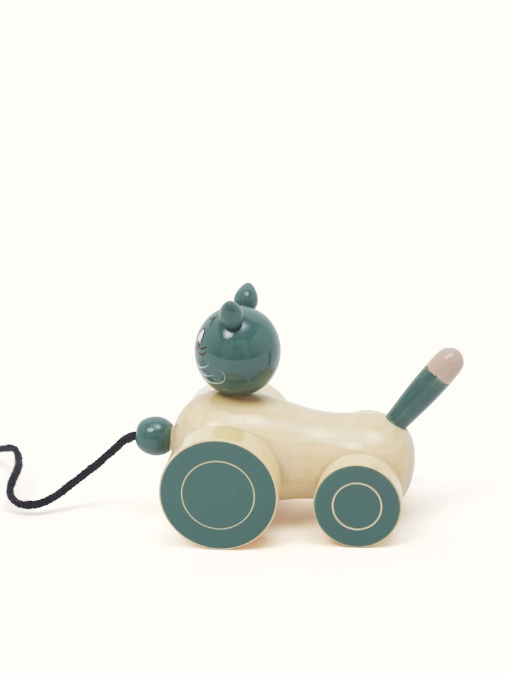 Side view of Channapatna Ivory Wood Cat Pulling Toy in Off-White, highlighting the smooth finish and playful design