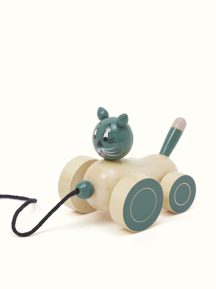 Close-up view of Channapatna Ivory Wood Cat Pulling Toy in Off-White, focusing on the detailed woodwork and finish