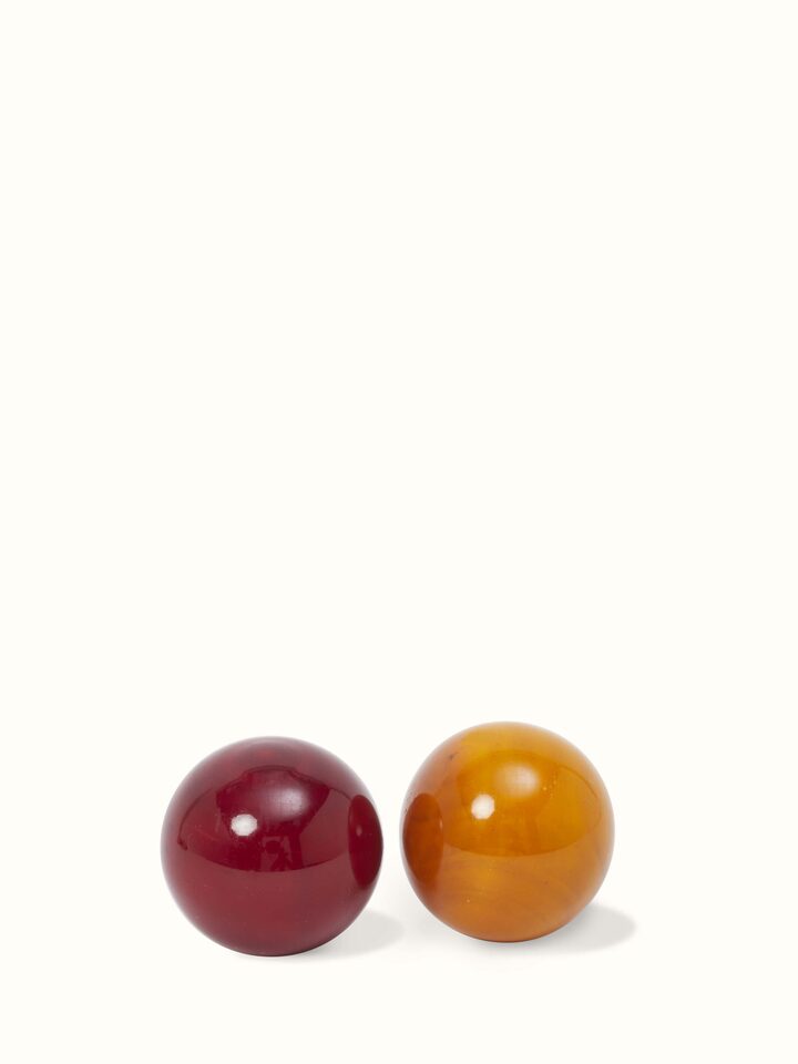 Top view of Channapatna Turnery 8-Piece Snow Ball Game in green, showcasing the smooth surface and polished finish