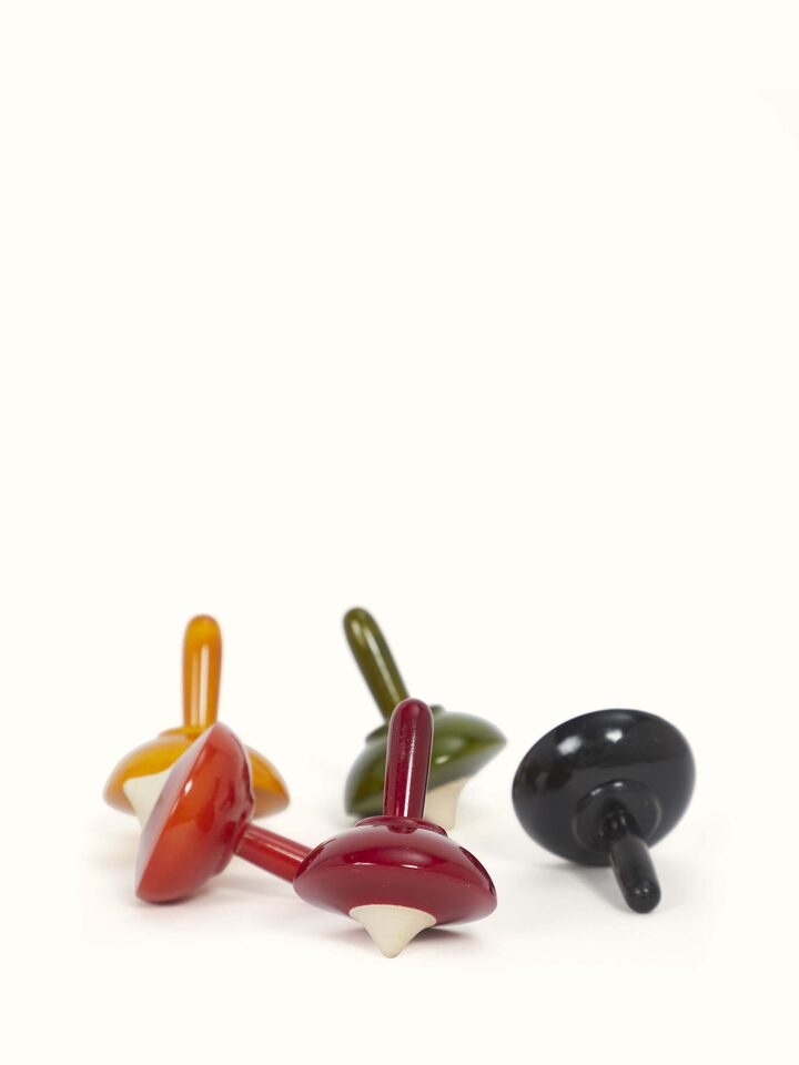 Detailed view of Channapatna ivory wood umbrella spinning toys, highlighting their intricate design and colors.