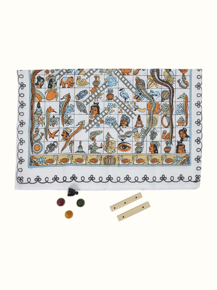 Front view of Channapatna ivory wood snake and ladders board game in white