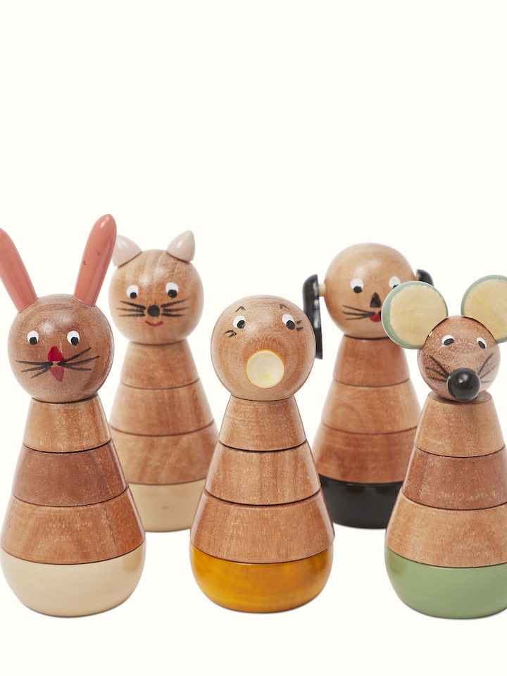 Side view of Channapatna ivory wood counting set in beige showcasing the traditional design and smooth finish.