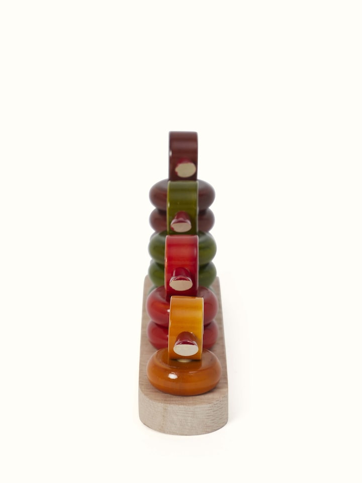 Angled view of Channapatna Ivory Wood Stacking Ducks (4 pcs) showing stacking mechanism