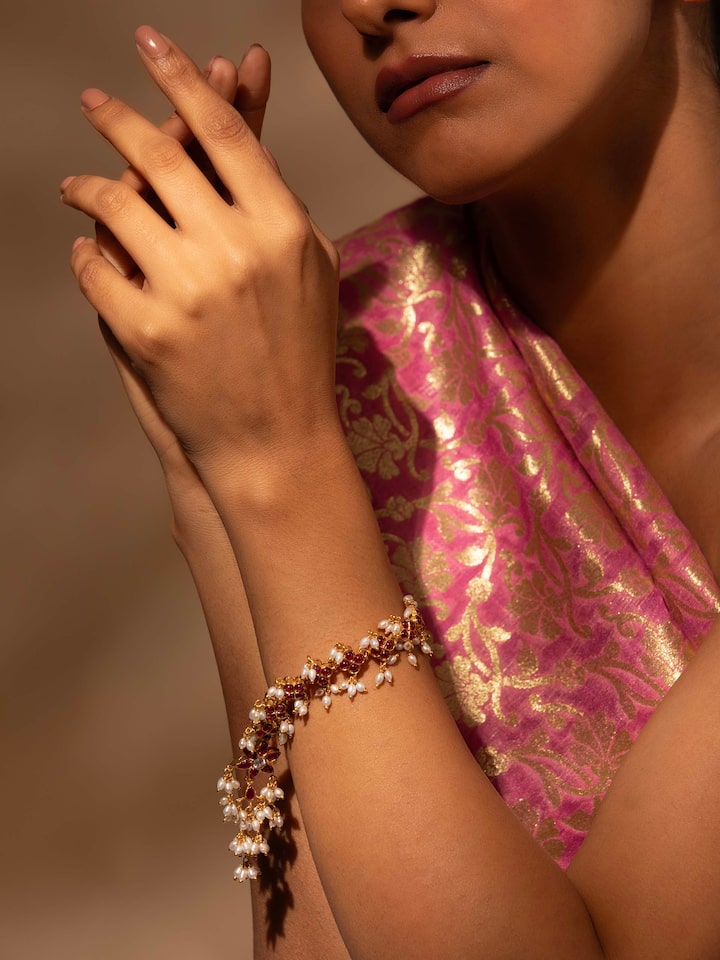 Styled detail view of Guttapusalu Silver Flexible Bracelet worn on the wrist, shown in an alternate styled shot