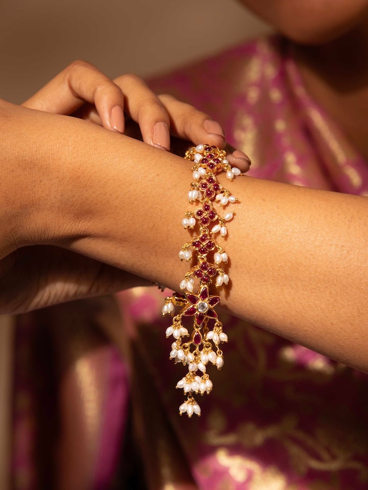 Styled detail view of Guttapusalu Silver Flexible Bracelet worn on the wrist, shown in another styled shot
