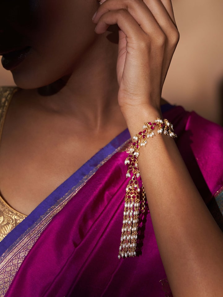 Angled view of Guttapusalu Silver Flexible Bracelet showcasing its intricate silver detailing and flexible design.