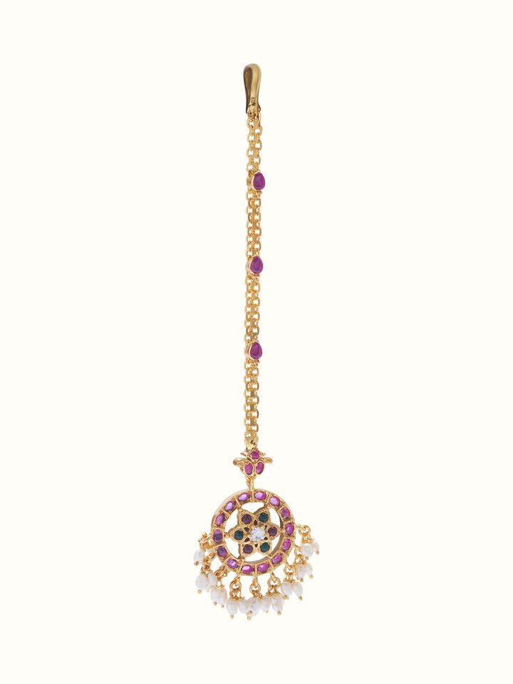 Front view of Guttapusalu silver maangtika showcasing traditional motifs and pearl embellishments