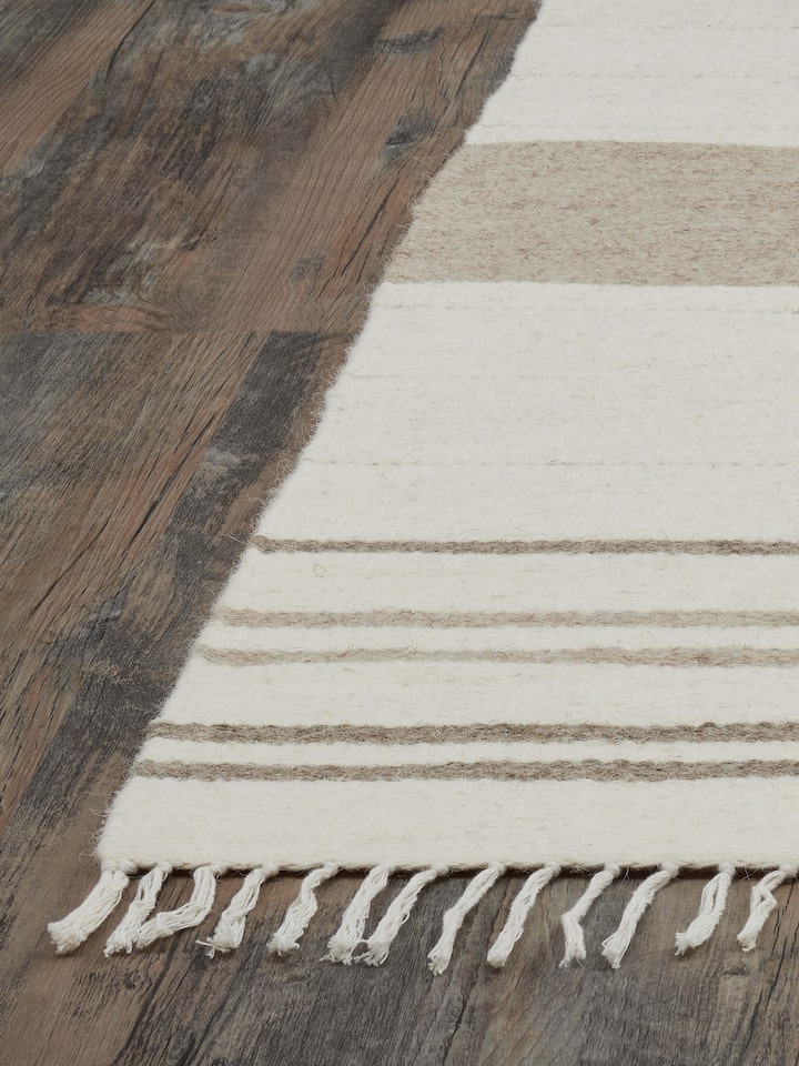 Detailed view of Nomad Stripes Ivory Beige Jawaja wool & cotton handloom dhurrie focusing on the striped pattern and fabric texture.