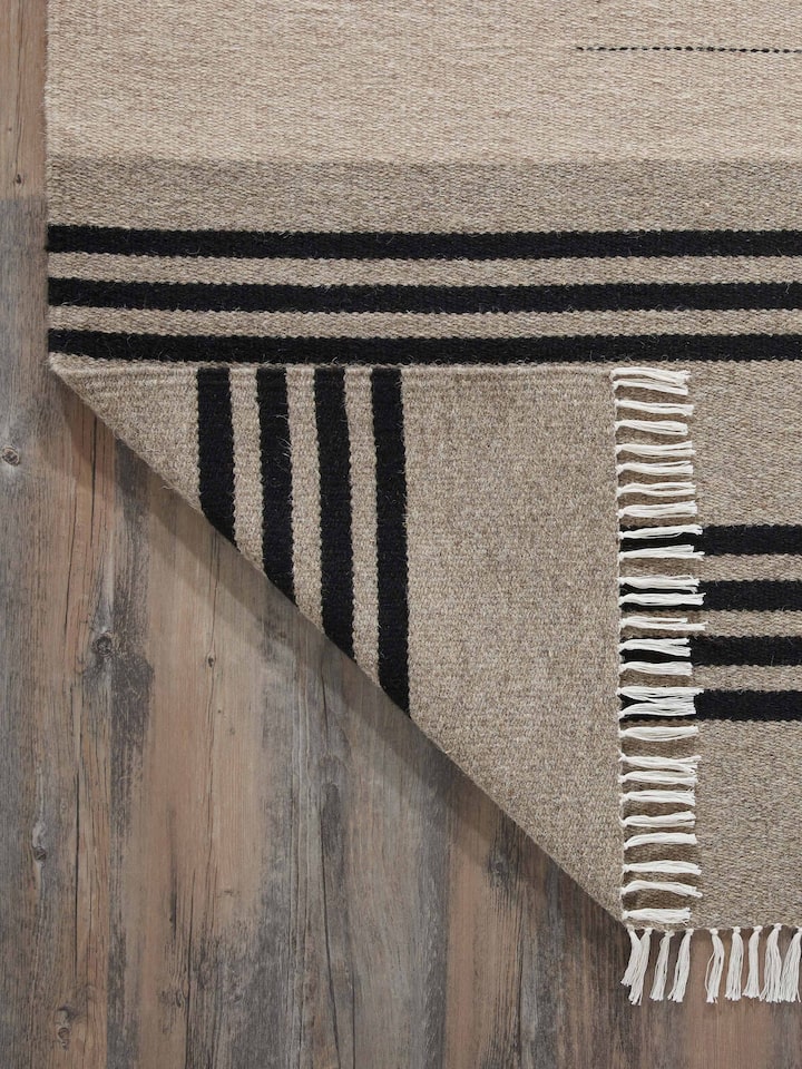 Detailed view of Nomad stripes beige black Jawaja wool & cotton handloom dhurrie (4x6 ft) focusing on the striped pattern and wool-cotton blend.