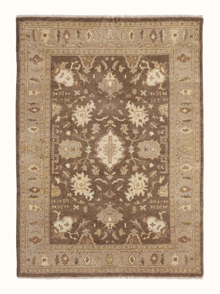 Full view of Oushak traditional brown Jaipur wool hand-knotted rug, highlighting the intricate design and rich brown tones.