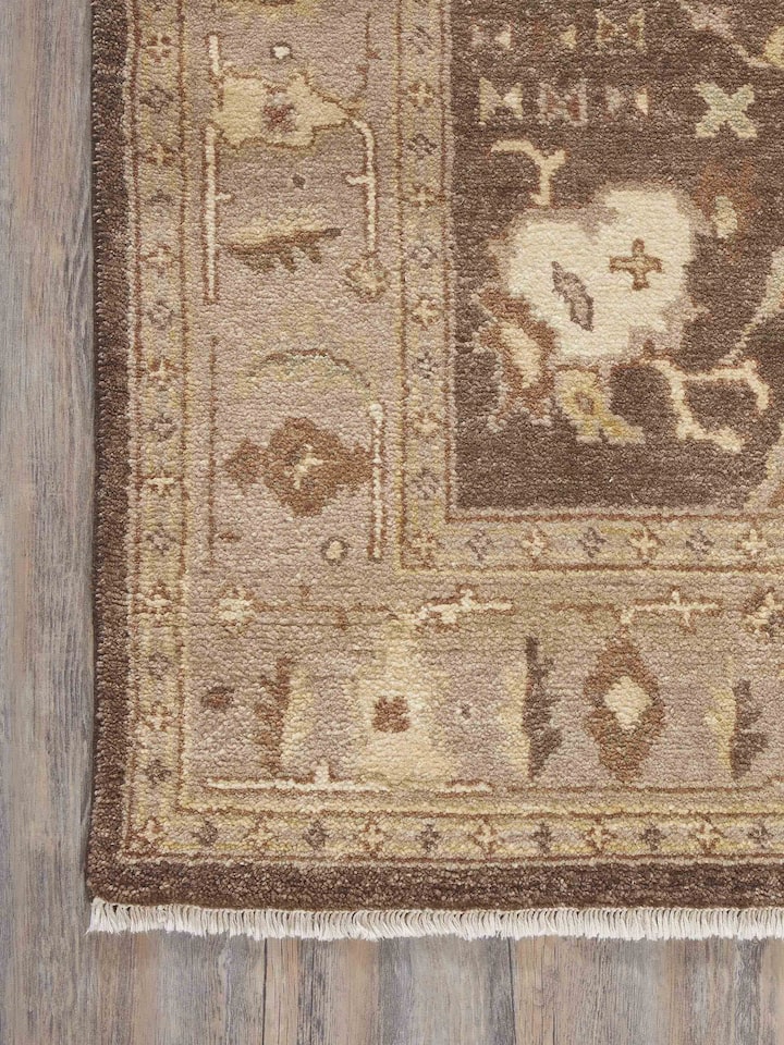 Side view of Oushak traditional brown Jaipur wool hand-knotted rug, focusing on the thickness and quality of the wool.