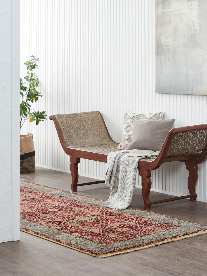 Lifestyle view of hand-knotted red Ziegler Jaipur wool runner in a narrow hallway setting