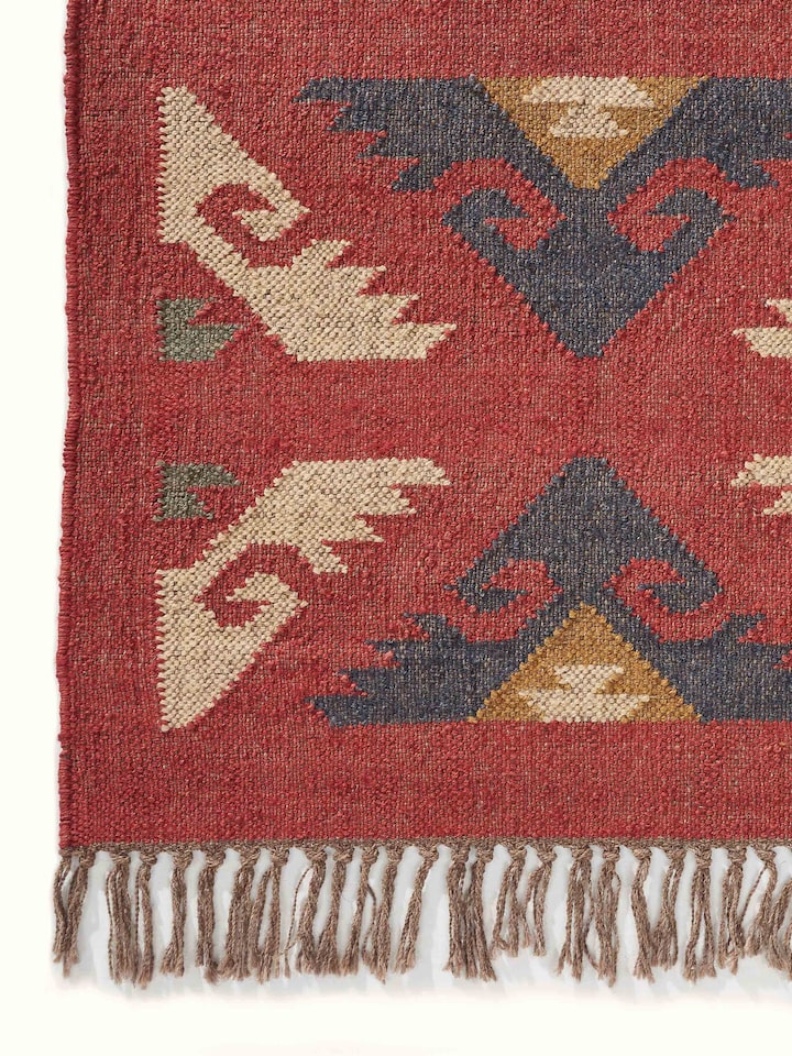 Detailed view of Traditional kilim red lawan wool & jute panja dhurrie highlighting the pattern and texture