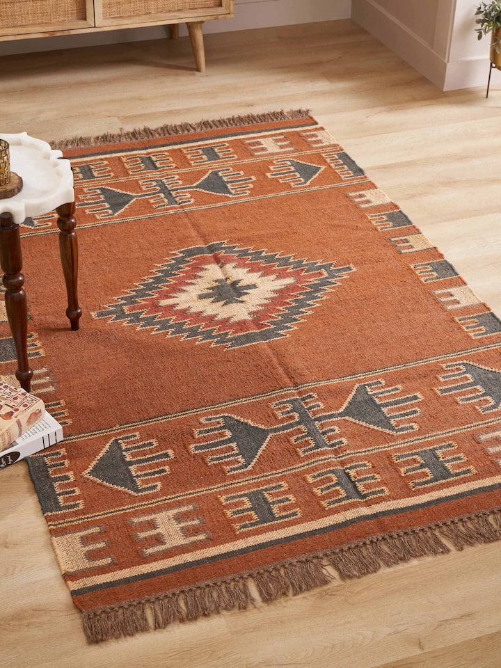 Side view of Traditional Kilim rust lawan wool & jute panja dhurrie showcasing the texture and craftsmanship of the dhurrie