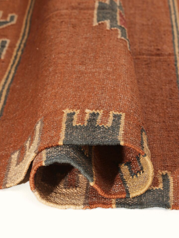 Detailed view of Traditional Kilim rust lawan wool & jute panja dhurrie displaying the pattern and material texture