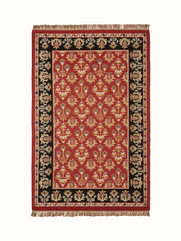 Full view of Traditional floral kilim rust salawas wool & cotton panja dhurrie showcasing its vibrant floral patterns and rich colors