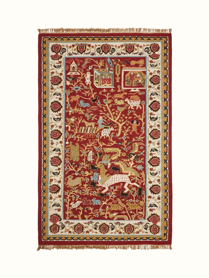 Village pictorial red wool & cotton panja dhurrie with a traditional design, showing the full rug and vibrant colors