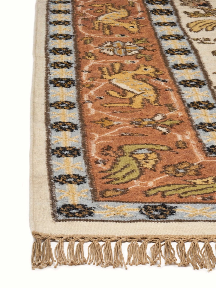 Detailed close-up of Kilim hunting salawas wool & cotton panja dhurrie, showcasing the weaving and intricate patterns.