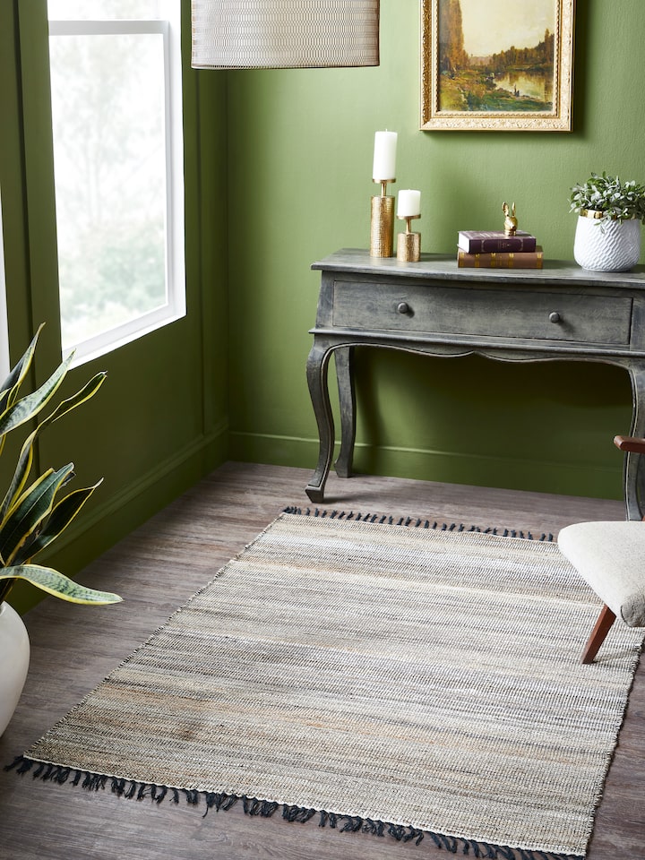 Lifestyle image of Lawan rug crafted from jute and wool, featuring a beige and charcoal textured pattern for earthy modern interiors.