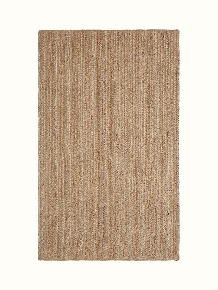 Braided stripe beige Lawan jute natural fibre rug, showcasing the texture and braided pattern.